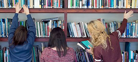 This image is of Sussex students searching for books in the library. The image is meant to convey the overall feeling of students searching effectively and productively in and around the library