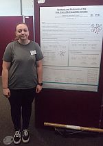 Maddie with her poster at the Dalton 2018 meeting