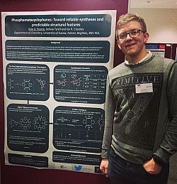 Kyle with his poster at the Dalton 2018 meeting