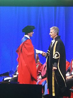 Kyle receiving his degree from the VC
