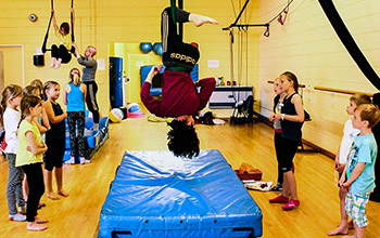Children getting involved in an indoor gymnastic activity