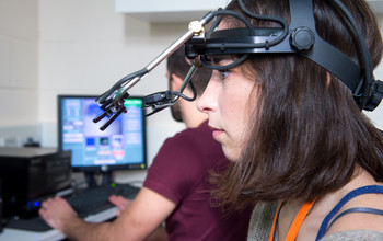 A researcher using psychology equipment at the University of Sussex