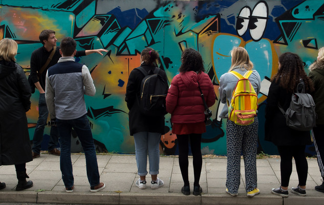 Students studying an art work in Brighton city centre