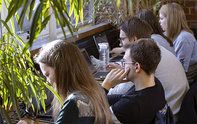 Students studying in a study space at the University of Sussex