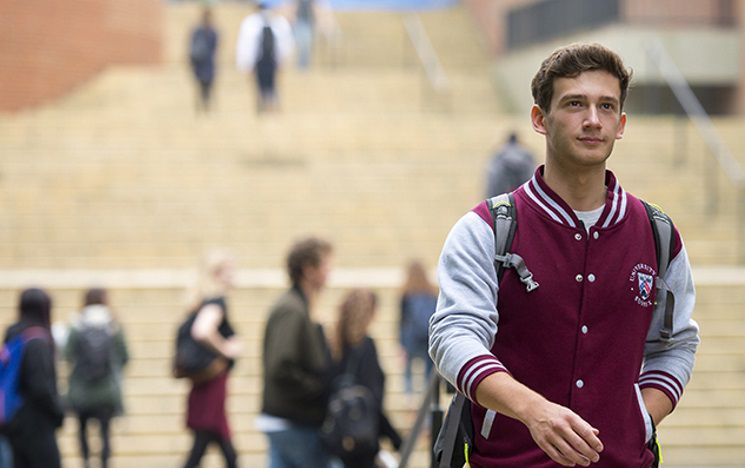student walking through campus