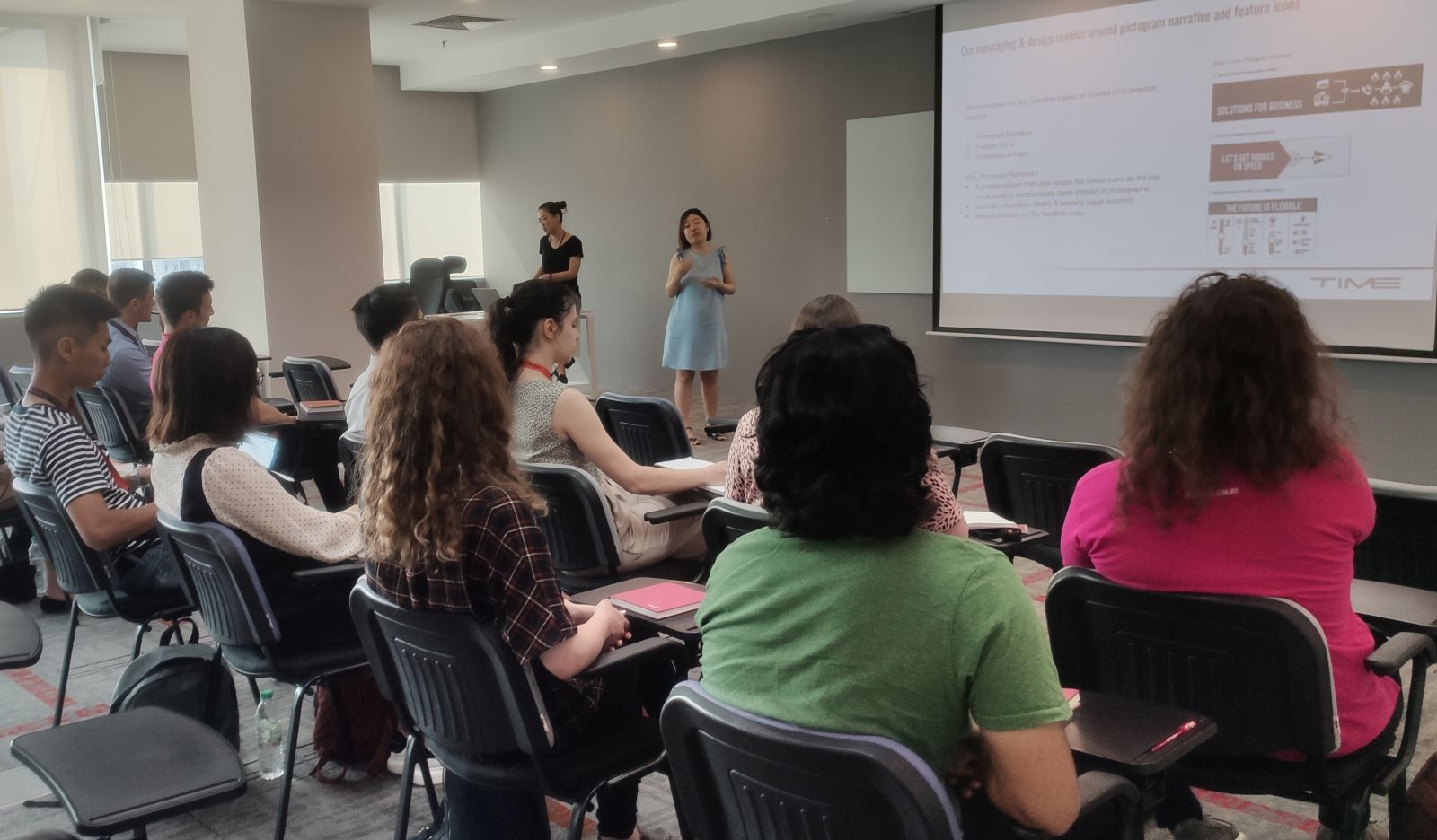 Photo of the students watching a presentation at their internship