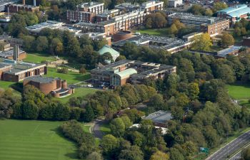 An aerial image showing the University of Sussex campus set among the South Downs National Park