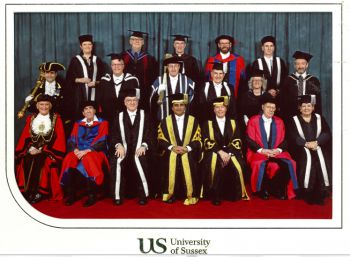 Dr (Jim) Perry James Browne at his DPhil graduation. He is seated in his graduation robes in the front row, second from left, and is surrounded by the VC and other eminaries.