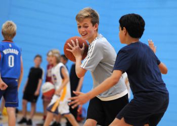 Children playing basketball in the University Sport Centre