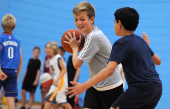 Children playing basketball in the University Sport Centre