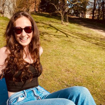 Emma Fallon, Student Ambassador, relaxing in a park