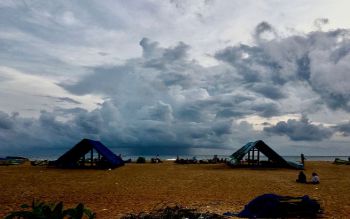 Rain clouds approach the shores of Puthiyathura village of Thiruvananthapuram district in southwestern India