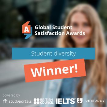 A banner detailing the University's global award win in student diversity is laid over a faded out image of a female student wearing a coat