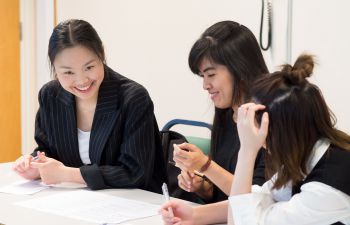 Three female students in an English Language for Academic Study session