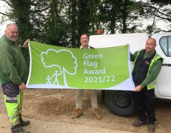 SEF Grounds team holding the Green Flag Award 2021 flag