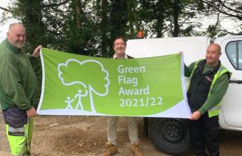 SEF Grounds team holding the Green Flag Award 2021 flag