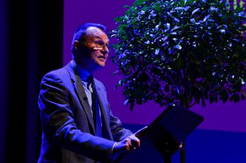 University of Sussex Vice-Chancellor Adam Tickell speaking at a podium at the Better World event