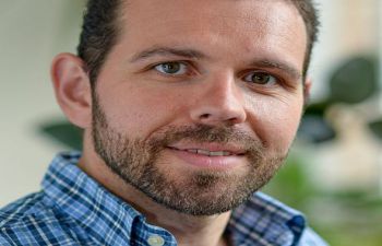 A portrait headshot of Professor Georgios Giamas