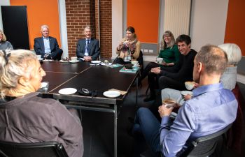 A photo of the Climate Coffees event showing the VC and staff talking