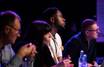 Four judges from Pitch for the Planet 2021, including Adam Tickell, the former Vice-Chancellor, listen as a student pitches their idea off camera.