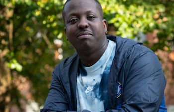 Image of the late Jamal Edwards looking into camera, on campus