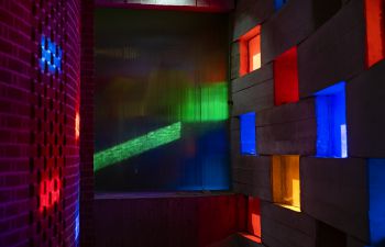 Light coming through the coloured windows of the Meeting House