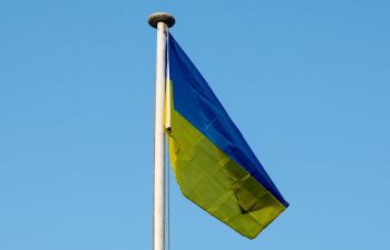 The blue and yellow Ukrainian flag flies above Sussex House on the University of Sussex campus