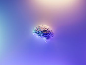 Graphic of a brain surrounded by purple gradient light