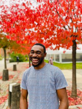 Portrait of Joshua smiling in the Spring time