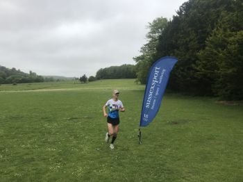 Gail Davey crossing the finishing line