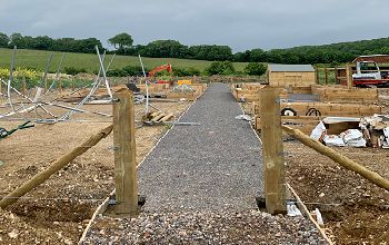 The new student garden is pictured under construction, with the South Downs in the background