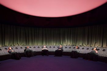 Several people reclined in chairs taking part in the Dreamachine live experience