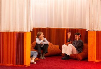 A group of four people sitting on beanbags discussing the Dreamachine experience