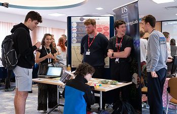 A group of people displaying a research project at the Celebration of Sussex Neuroscience event