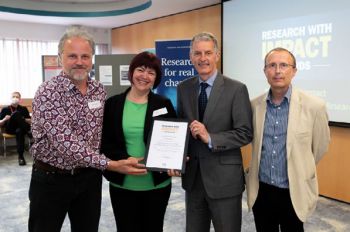 Dr Mirela Barbu and Prof Martin Spinelli receive Research Impact Award, presented by VC Prof David Maguire and P-VC Research Prof Keith Jones