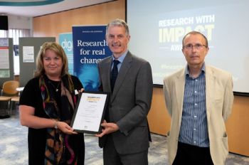 Dr Rebecca Vine receives Research Impact Award, presented by VC Prof David Maguire and P-VC Research Prof Keith Jones