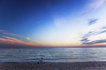 A photograph showing Brighton beach at sunset