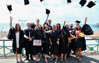 Sussex graduates celebrate on Brighton seafront