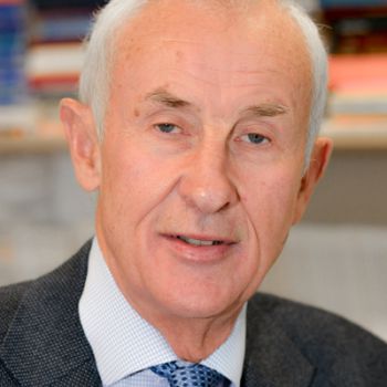 A portrait photo of Professor David Storey, OBE