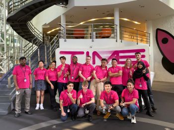 A group of Business School students and faculty at the TIMEdotCom headquarters