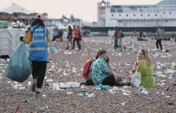 A picture of Brighton beach covered in plastic litter following a big city event
