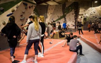 Young people in an indoor climbing centre