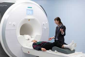 Dr Charlotte Rae conducts an MRI brain scan for the Sussex 4 Day Week trial