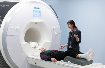 Dr Charlotte Rae conducts an MRI brain scan for the Sussex 4 Day Week trial