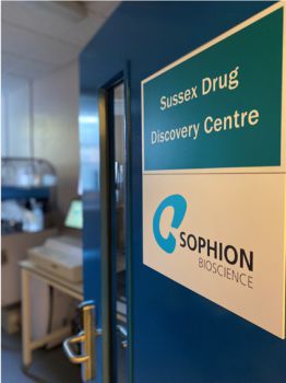 An open door with two signs, one reading 'Sussex Drug Discovery Centre' the other 'Sophion Bioscience'