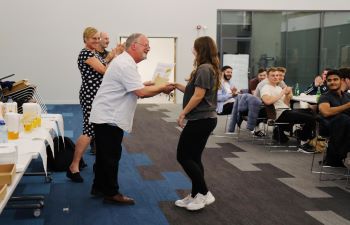 Business School student accepting their certificate