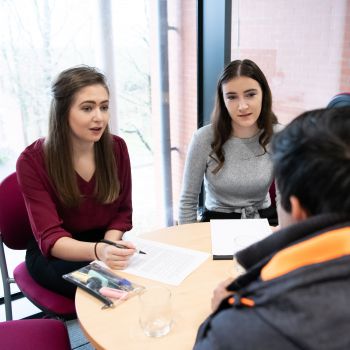 University of Sussex law students helping a client during a law clinic