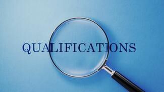 Image of magnifying glass hovering over the word Qualifications