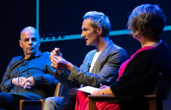 Musician Dan Gillespie Sells speaks on the Attenborough Centre stage. David Ruebain and Sharon Webb listen