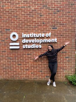 Mahima standing outside the Insitute of Development Studies building